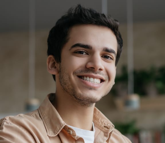 Young man sitting at a coffee shop